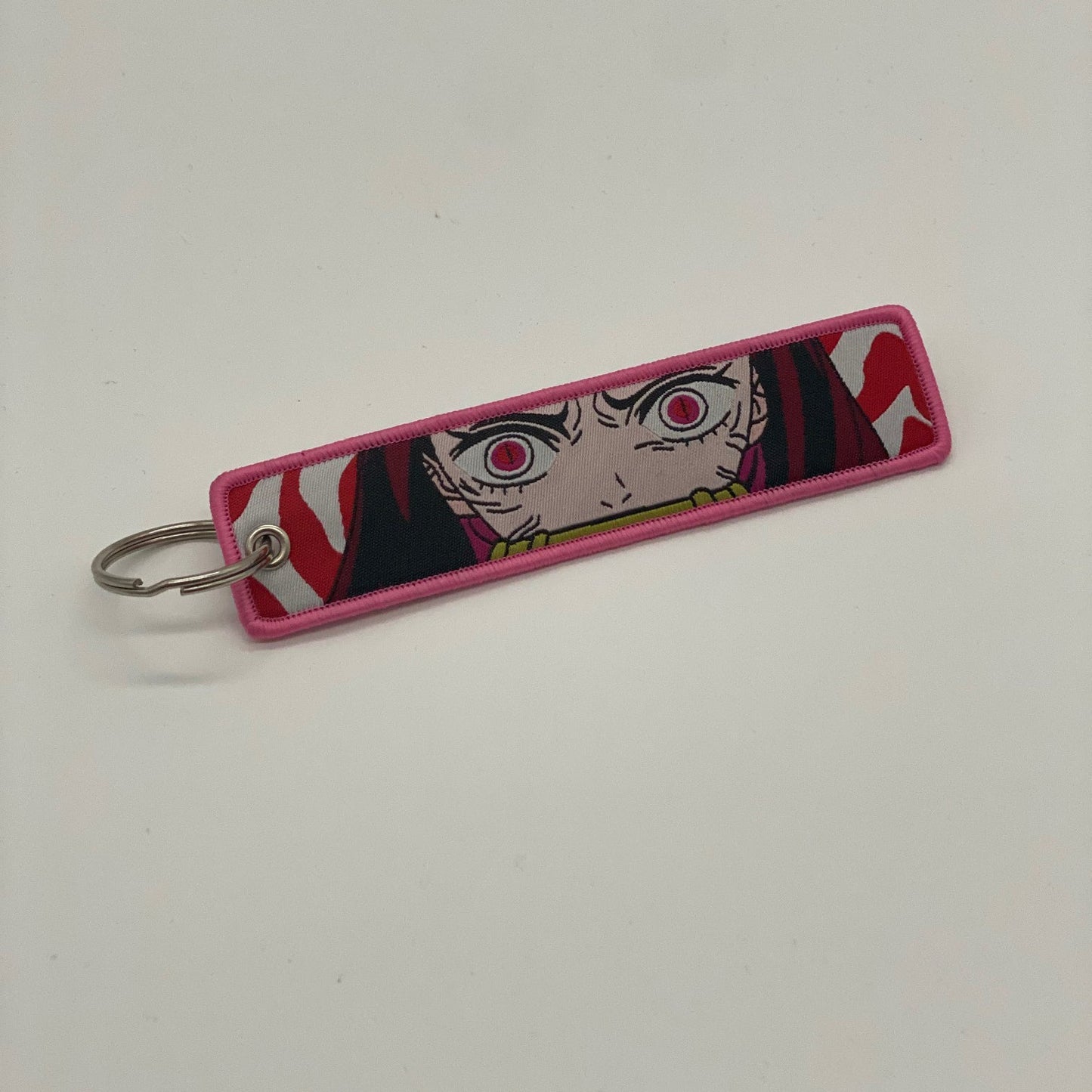 LIMITED DEMON SLAYER NEZUKO KAMADO RAGE DUAL-SIDED EMBROIDERED KEY CHAIN