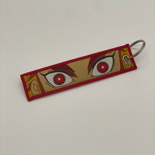 LIMITED DEMON SLAYER KYOJURO RENGOKU DUAL-SIDED EMBROIDERED KEY CHAIN