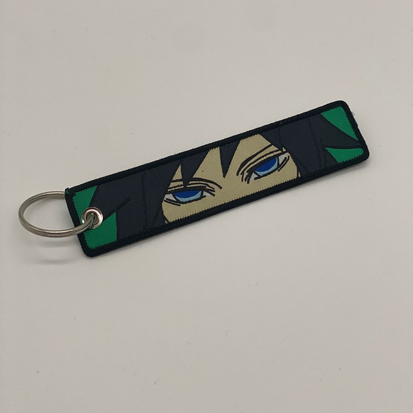 LIMITED DEMON SLAYER GIYU TOMIOKA DUAL-SIDED EMBROIDERED KEY CHAIN